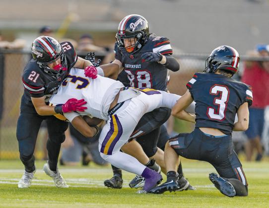 The Davenport defense swarmed Weleetka all night. Making this tackle are, from left, Reece Murfin, Conner Tipton and Chace Buchanan. Photo/Rick Hester