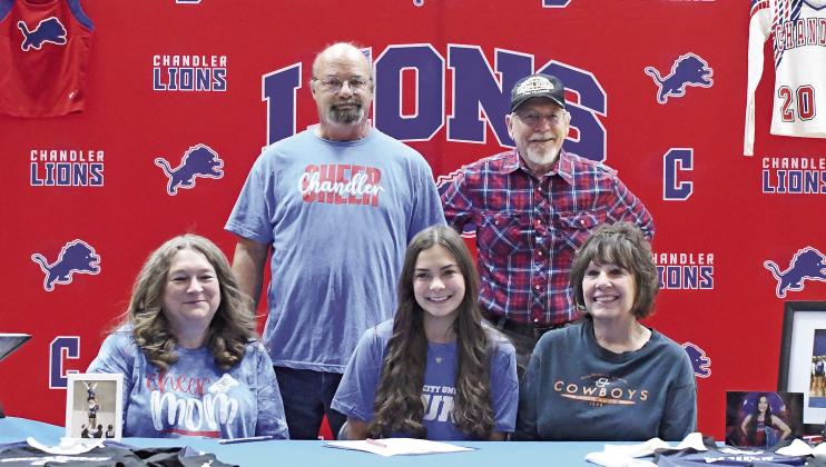 Chandler’s Kaitlyn Aucoin signed a letter of intent last week for Oklahoma City University’s stunt team. She is pictured above with, back row, Robbie Aucoin and Robert Stieber and, front row, Robbi Aucoin and Rita Stieber. Photo/Brian Blansett