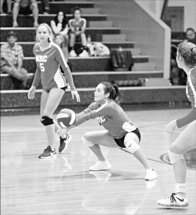 Emma Monge passes for North Rock Creek during the Lady Cougars’ volleyball match against Liberty Baptist Academy last week. The Lady Cougars will host a district tournament Thursday. Photo/Brian Blansett