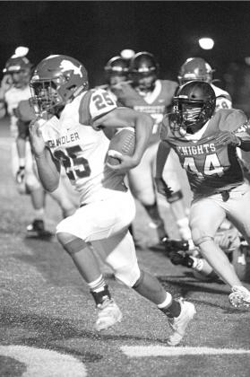 Chandler’s Casmen Hill (25) sets off on a long touchdown run in the fourth quarter of the Lions’ win over Crossings Christian Friday night. Photo/Brian Blansett