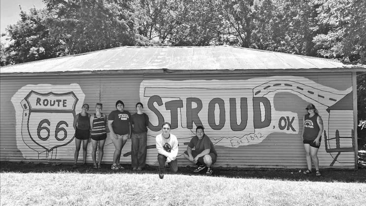 Stroud art students are hard at work on the Route 66 mural at a property in Stroud owned by Janna and John Collins. The owners wanted to celebrate the Centenntial in style and reached out to the school for help. Photos/Janna Collins