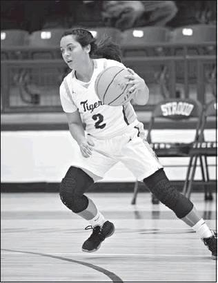 Top left, Skyla Baker (2) advances the ball into the front court.
