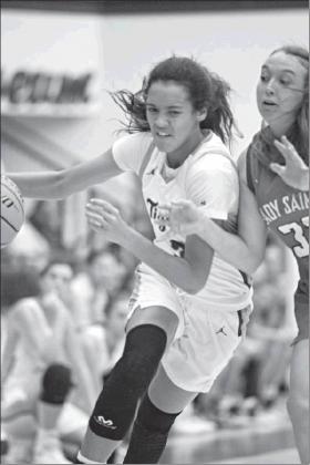 Above, Kileigh Mixon (3) drives to the hoop in the Stroud girls’ win over Oklahoma Christisan School in the 66 Coliseum Classic last week.