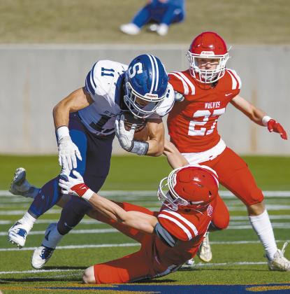 Top left, Trystan Baker picks up yardage. Photo/Rick Hester.