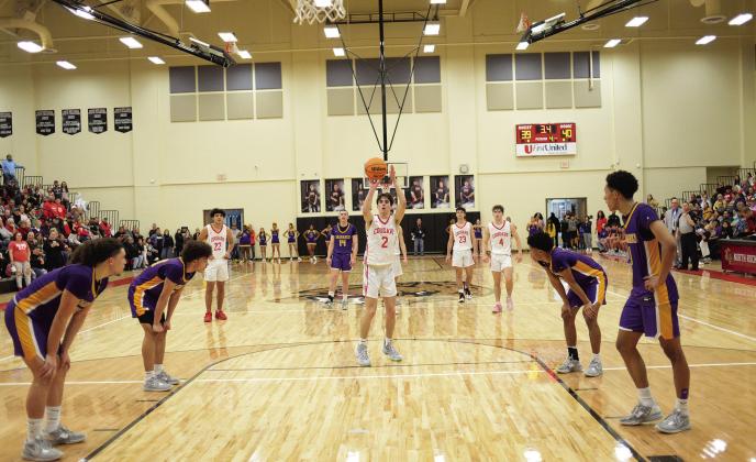 David King shoots the first of two game-clinching free throws for North Rock Creek against Anadarko Saturday night with 3.4 ticks left to play. Photo/Brian Blansett