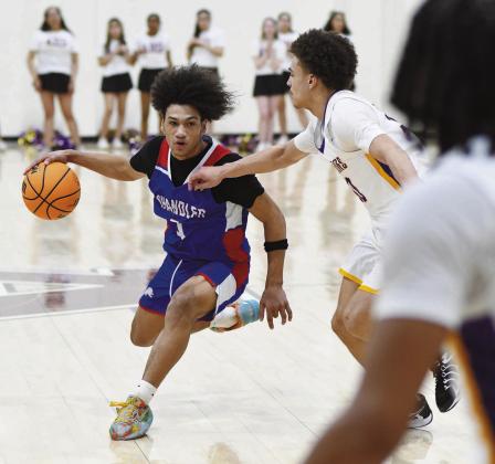 Chandler guard Jordan Denson looks to penetrate the Anadarko defense during first-half action Friday during Chandler’s 48-46 win. Denson had 16 of Chandler’s 22 firsthalf points and 22 for the game. Photo/Brian Blansett