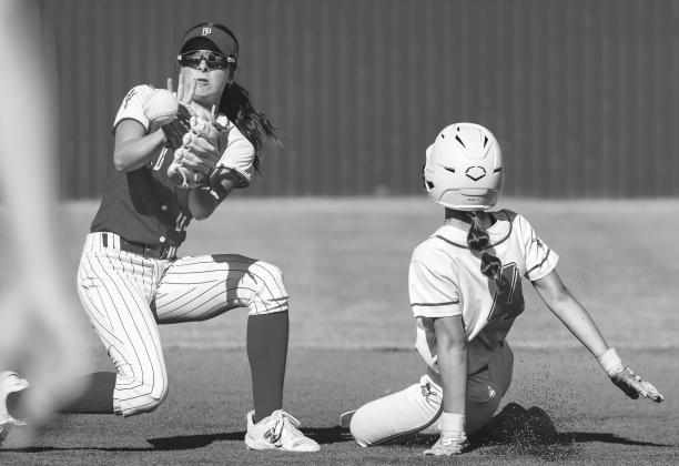 Prague Shortstop Ainsley Auld fields the ball as Dale’s Jayse Smith slides safely into second base during action Saturday at the Dale Tournament. Photo/Rick Hester