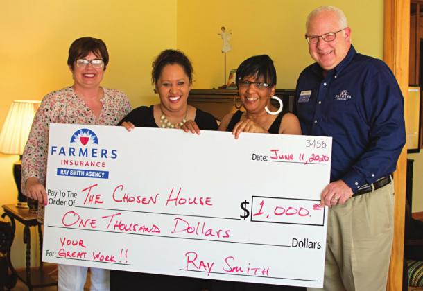 Pictured above to the right, from left to right: Tracy Smith, Kimberly Battle, Mari Battle and Ship Smith stand with the $1,000 check.