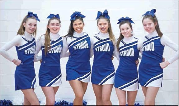 Bottom right, the Stroud cheerleaders pose during a break in the action. Photos/Brian Blansett