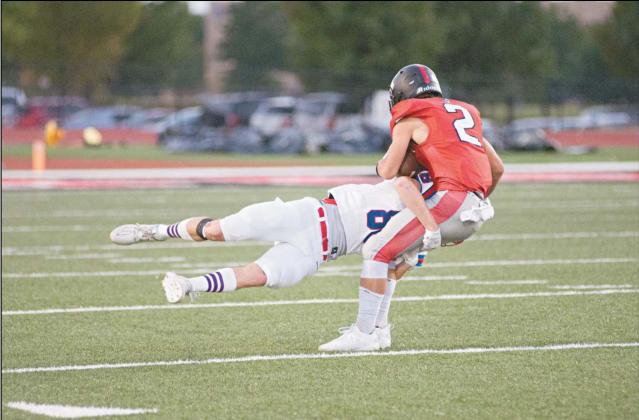 Ashton Yates wraps up Crossings Christian receiver Jonah Mahen with an open-field tackle Friday night. Photo/Brian Blansett
