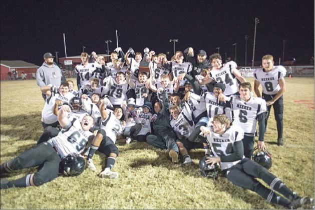The Meeker Bulldogs pose for a picture with the new trophy awarded to the winner in their long-standing rivalry with Prague. Photo/Brian Blansett