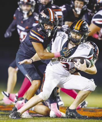 Davenport's Devin Burciaga-Murfin pulls down a Keota ballcarrier for a loss. Photo/Rick Hester