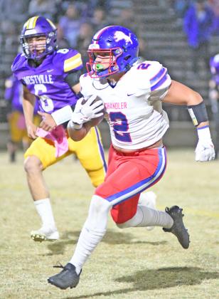 Grant McGinnis (2) heads for the end zone in the first half against Westville Friday night. McGinnis scored four touchdowns as the Lions ran out to a 42-0 lead at halftime. Photo/Brian Blansett