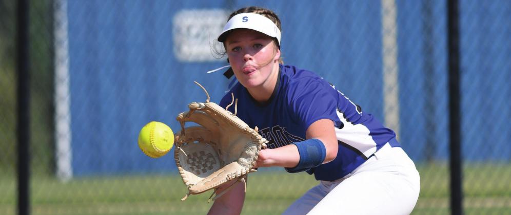 Stroud first baseman Charley Coleman is all focus as she takes a throw for an out against Prague. Photo/Brian Blansett