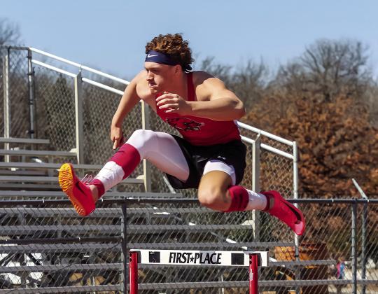 Top, the Stroud trio of Peyton Davis, left, Kileigh Mixon, center, and Kenlee Parrick, right, compete in the 100 hurdles at the Luther track meet. Above, is Maddox Motley from North Rock Creek. Photos/Mario Holland
