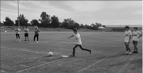 Agra Sophomore Andrew Howard scores during a game of kickball at the Native Games held Sep. 21 at Perkins-Tryon High School.