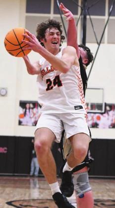 Above, Hayden Brooks (24) grabs a rebound Davenport against Allen Saturday night in the County Invitational tournament. Those two te could meet again in the regional tournament right, Wellston’s Kaylee Danker (22) finds he