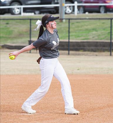 Katy Buxton is all smiles as she rounds third following her home run against Wellston Thursday. The Lady Bulldogs got off to a 3-0 start before the coronavirus put the brakes to their season. Below, Madison Buoy delivers a pitch to the plate. PhotosBrian Blansett