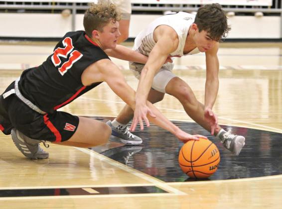 Above, Wellston’s Kage Danker (21) and Meeker’s Braxton Bussell go for a loose ball near the foul line on Friday while Rayne Jones (12) puts up tall defense for North Rock Creek against Chandler’s Luke Russell (10). Photos/Traci Cook and Brian Blansett