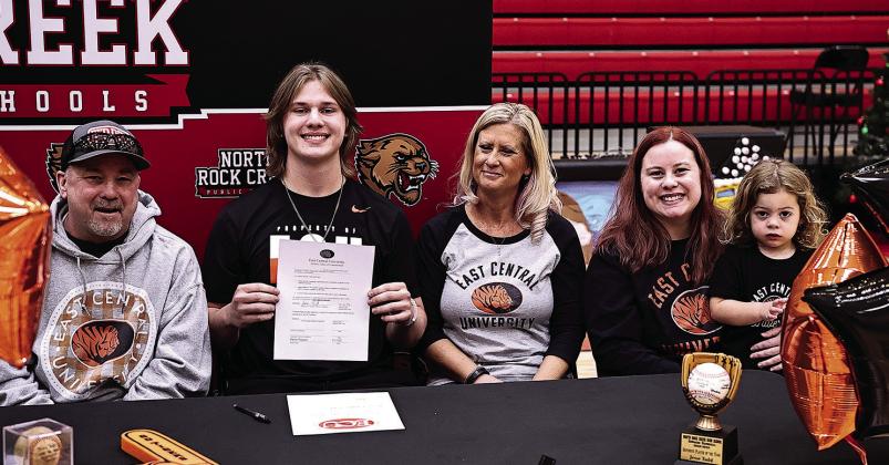 Two North Rock Creek athletes signed to play college sports last week. At left, Jesse Todd signed to play baseball with East Central University and defending state champion hurdler Maddox Motley, right, signed to run track at Oklahoma Baptist University. Photos/Sheryl Gowin.