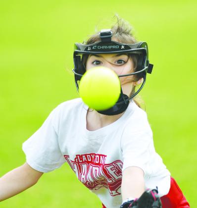 Joy Alsip, the daughter of Ben and Jennifer Alsip of Chandler, is all focus on a pop fly during the annual Chandler softball camp last week. She made the catch with ease.