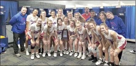 Above, the Lady Lions celebrate with their trophy. Photo provided.