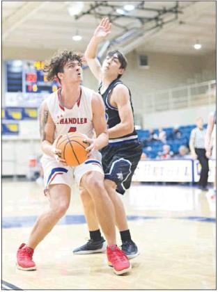 Below, Dylan Mahan has the ball in his hands and scoring on his mind. Photo/Brian Blansett