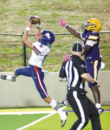 Chandler’s Karson Wilson (5) goes high for an interception in third quarter of the Lions’ game against Anadarko. Wilson’s interception stopped an Anadarko drive at the Lions’ 24-yard line and Jordan Denson scored on the next play to give Chandler a 22-13 lead. Photo/Brian Blansett
