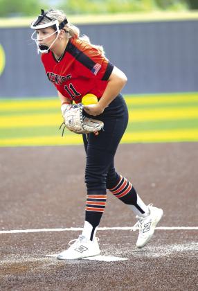 A field full of girls showed up for the annual Chandler softball camp last week. Above, Dani Weber participates in a fielding drill. The campers also worked on fielding (left) and took part in a spirited bunting game (below left). Photos/Brian Blansett