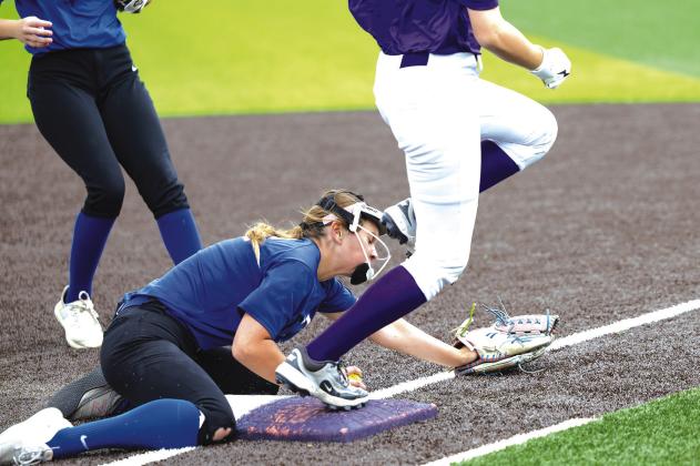 Carlee Williams from Stroud scooped up the ball and ran down the out at first against Bristow.