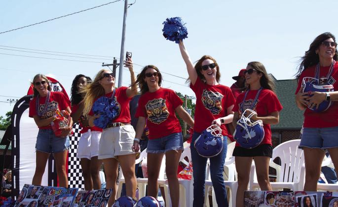 Members of the Class of 2006 cheer from their float on Saturday during Chandler’s annual alumni parade. The theme for this year’s parade celebrated the centennial of Route 66 as well as the semiquincentennial of the U.S. It was also the 120th birthday of the Chandler Alumni Association. Photo/Emily Kalka