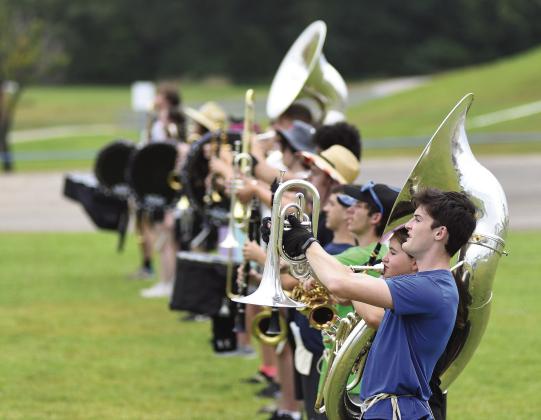 Senior Ian Radcliffe heads up the line of The Pride of Chandler on the last day of band camp on Aug. 3. New director Zac Fisher put the students through their paces in preparation for marching band season. Chandler plans to attend four competitions as well as performing at football games this year. Photo/Brian Blansett