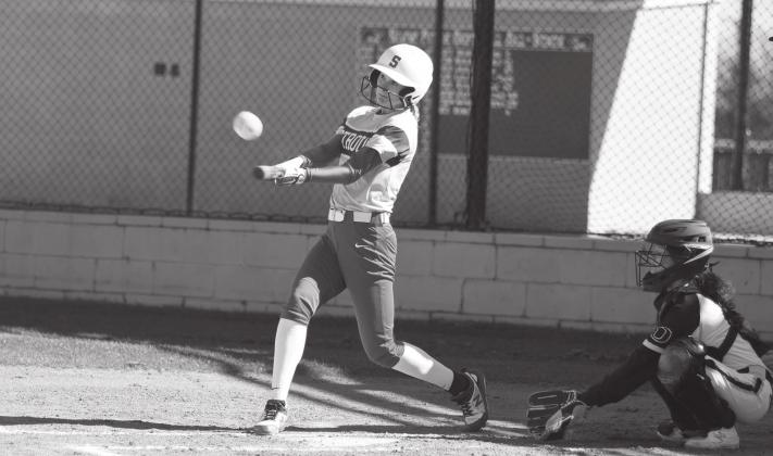 Stroud’s Madison Williams connects during the Lady Tigers’ 24-0 win over Okemah Thursday at Stroud. Photo/ Brian Blansett