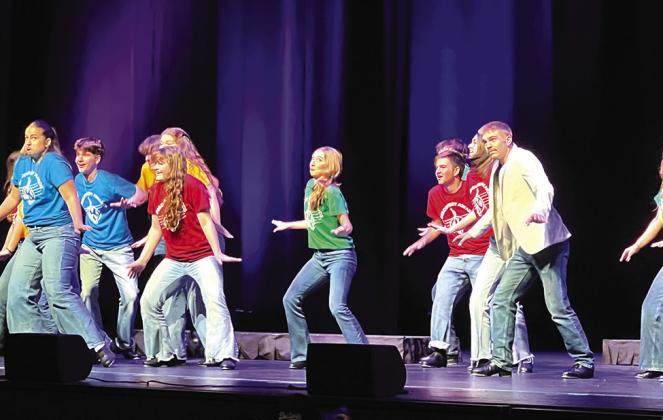 Bethany Descher and Weston Miller perform in a tap number. Bottom