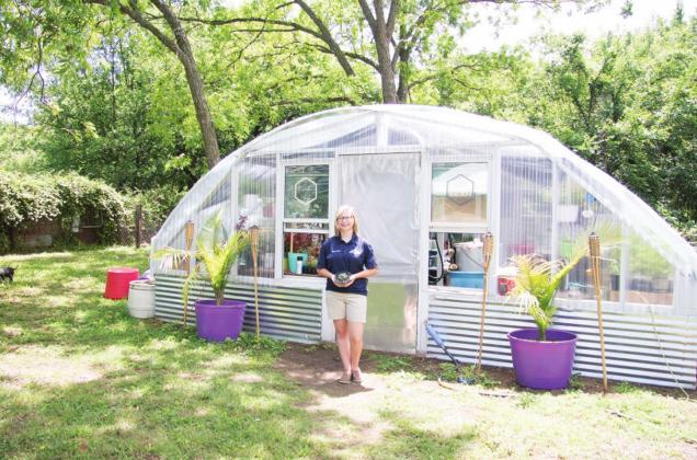 Shaley Barnes in front of her greenhouse. Photo/Kendra Johnson