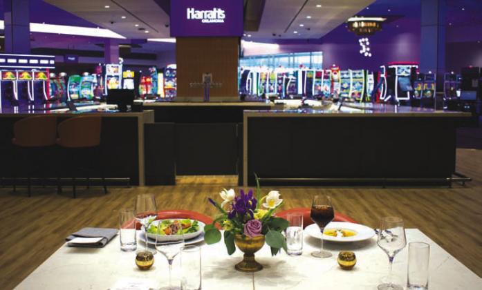 A look at the bar connected to Ember &amp;amp; Arrow, the main restaurant in Harrah’s Oklahoma, along with some of their main dishes on offer. Photo/Emily Kalka