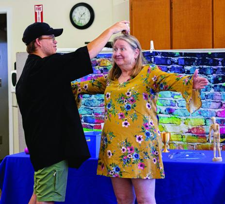 Professor Arthropod (left) visited the Chandler Public Library last Wednesday to tell stories and lead activities for the kids in attendance as part of the library’s summer reading activities. Librarian Carla Hale (right) participated in one of the interactive stories playing the part of a tree while Professor Arthropod placed stuffed animals and flowers on her. Some of the stories included lessons about science while others taught concepts like inclusivity, sharing and curiosity. Photo/Evan Kennemer
