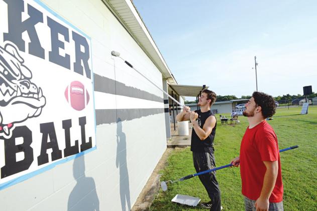 Painting the Meeker fieldhouse