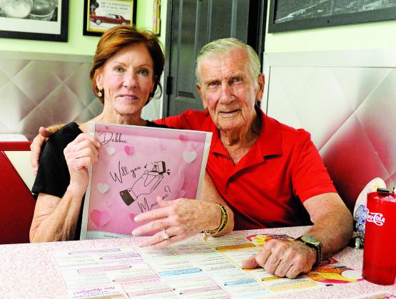 When Don Foster of Chandler decided to propose to Deborah Hodges of Oklahoma City, he came up with an innovative way. He took out a half-page color ad in the Lincoln County News and brought it and a ring when he took her to the Boomarang in Chandler on Wednesday afternoon. A bold move - but, hey. Faint heart never won fair lady. Deborah said ‘yes’ without hesitation. Photo/Brian Blansett
