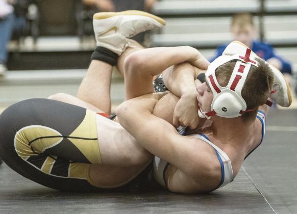 Chandler sophomore Bryar Dryden (white) pins his opponent with a spladle during a dual at Henryetta. Photo/Jennifer Pryor