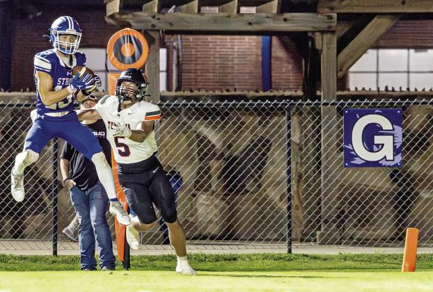 Aiden Collins intercepts a pass near the end of the game to preserve the Tigers’ victory. Photo/Beth Young.