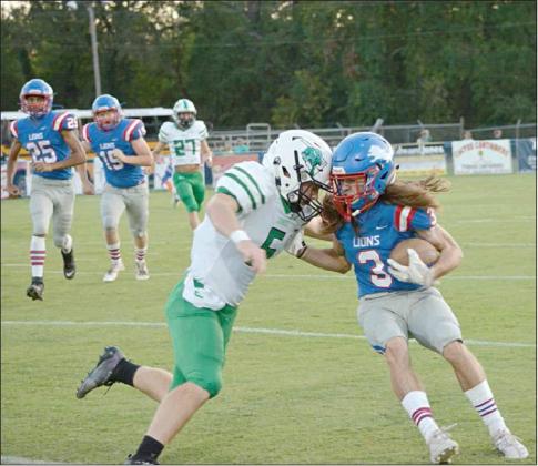 Senior Caedon Parris attempts to shed a Jones defender during the Lions first drive of the game. Parris finished with two receptions for 20 yards and a score, and also rushed for a 15-yard touchdown against the Longhorns. Photo/ Debbie Terronez
