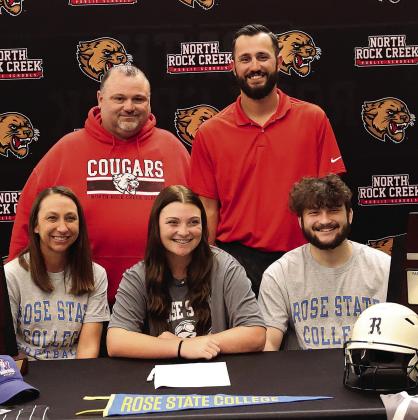 North Rock Creek’s Caty Baack signed a letter of intent to play college softball at Rose State College. She is flanked by her mother, Leah Johnson, and brother, Ryan Baack. In the back row are NRC assistant coach Michael Cox and head coach Chance Griffin. Photo/Sheryl Gowin