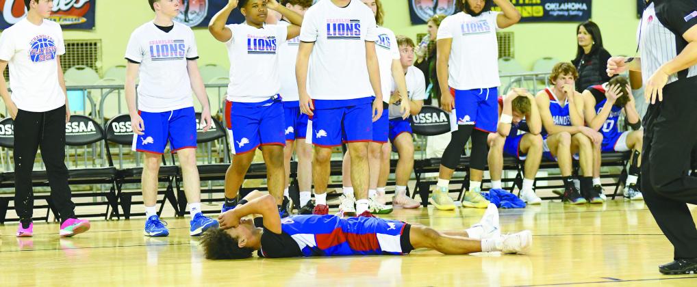Sophomore guard Jordan Denson went prone after the final horn ended the Lions’ overtime loss to Sequoyah-Claremore. Photo/Brian Blansett