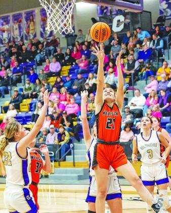 Wellston’s Savanah Gaylord (21) puts up a shot during the Lady Tigers’ district finals matchup against Okarche last week. Okarche won, 45-35, bt the WLTs advance to this week’s regional tournament, facing Hominy at 1 p.m. Thursday at Koarche. Photo/Jeremy Self