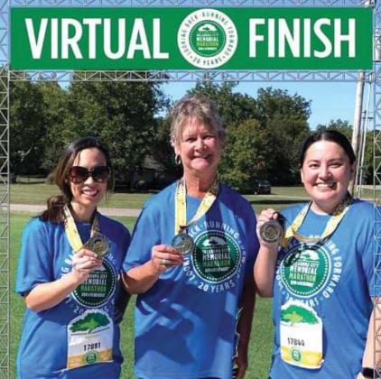 With medals in hand, Elizabeth Lau, Julie Bivin and Tiffany Morris stand at the virtual finish line of the OKC Memorial Run to Remember half marathon. Photo/submitted.