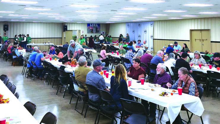 Attendees enjoy the 4-H Annual Pig Roast at the Lincoln County Fairgrounds. Photo/ Mickey Densmore