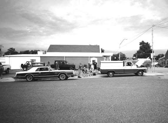 People pull up in the parking lot of Parks Brothers Funeral Home on Route 66/ Manvel in Chandler for Big Willy’s Hot Dogs Cruise Night in Chandler. There were 35 classic cars and bikes at the cruise, and a drawing for a prize from NAPA. Photo/Emily Kalka
