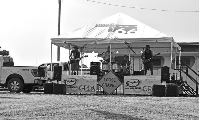 Local band Loose Gravel plays a set at Stroud’s Fourth of July celebration in Foster Park on Saturday before storms moved in. Photo/Emily Kalka