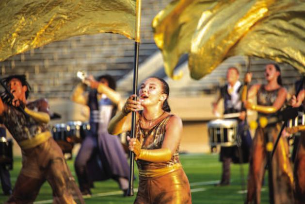 Both photos feature Izzy Simpson, a recent Chandler grad, as she performs as part of the Zephyrus Drum &amp;amp; Bugle Corp. Photos/David Lackey